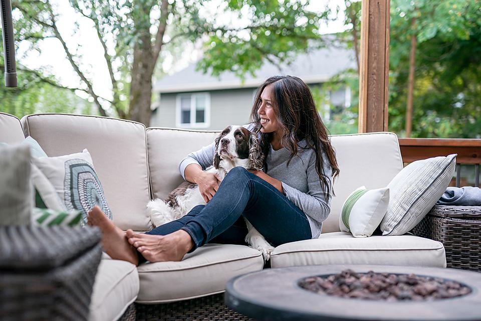 Woman relaxing on the sofa with her dog