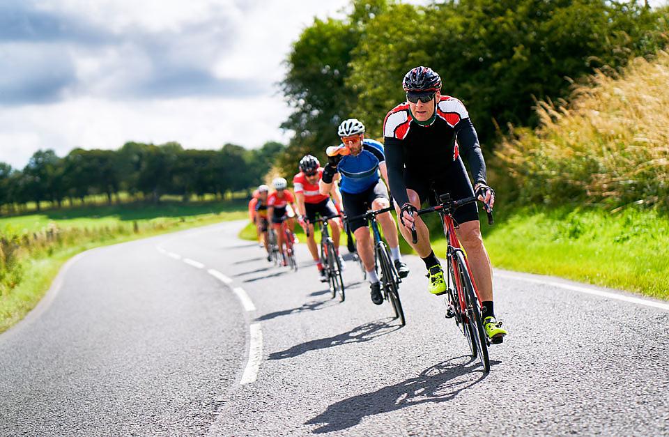 Cyclists riding on a country road